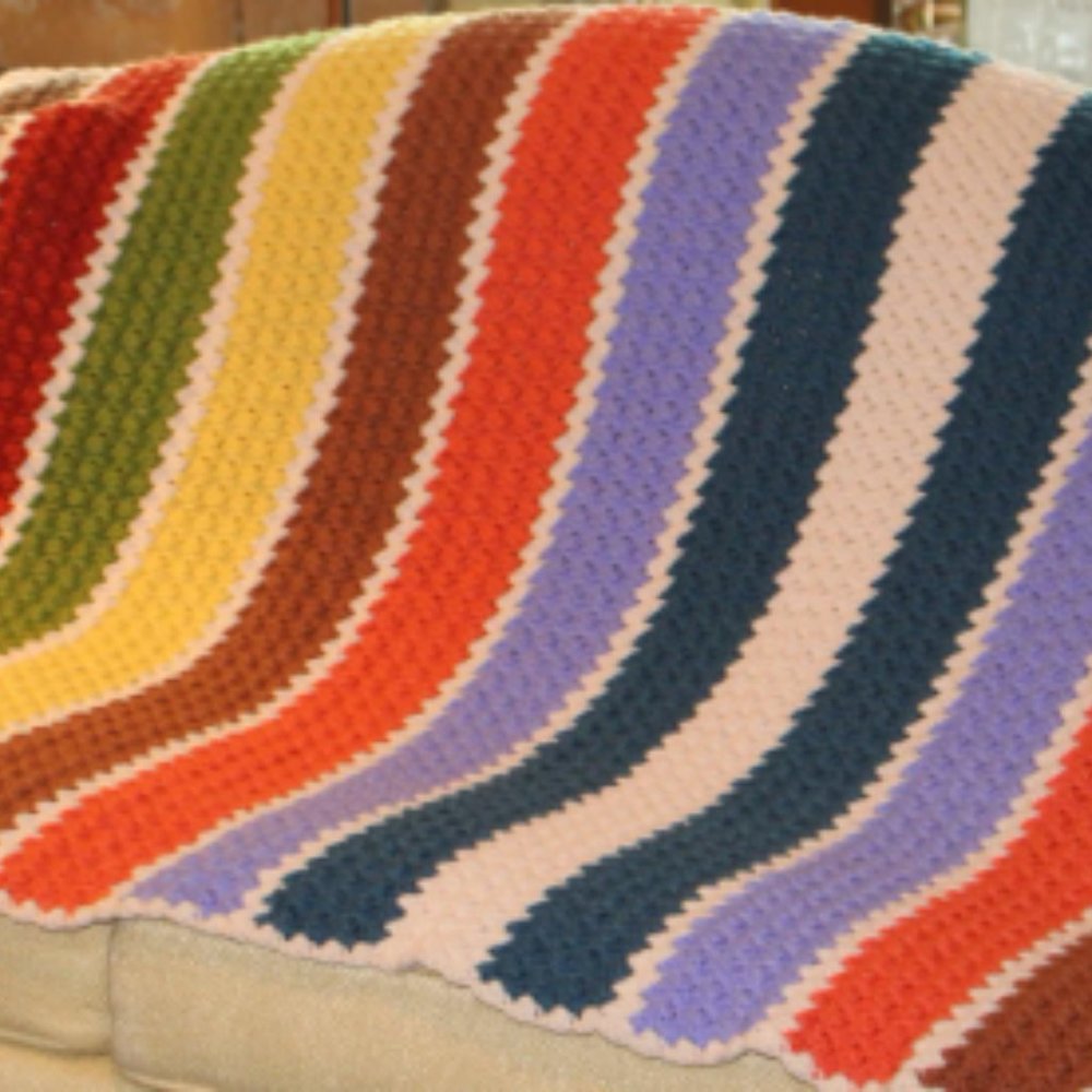 Vintage hand crocheted afghan in rainbow of colors